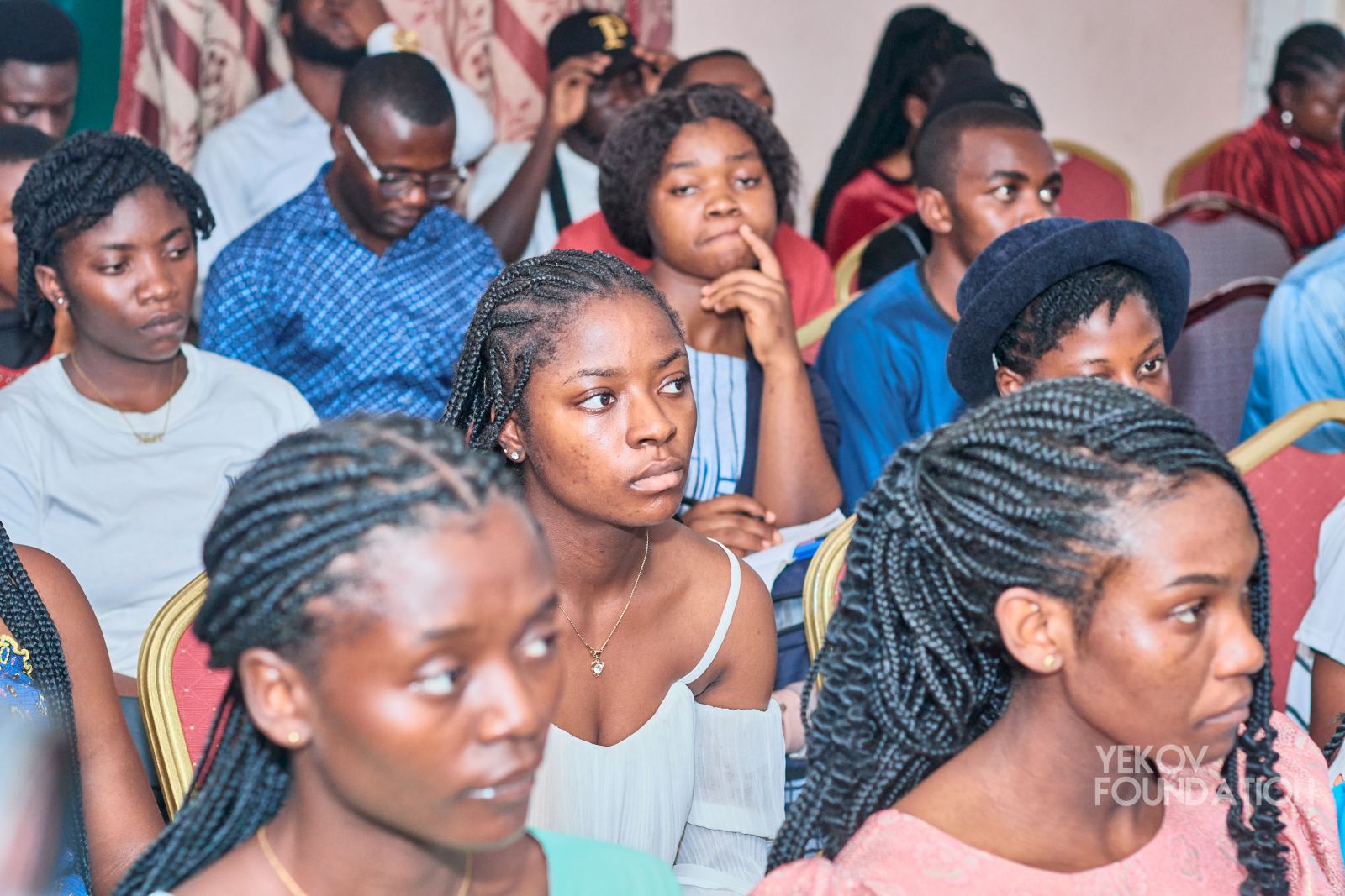 Young women in the audience listening to the panel