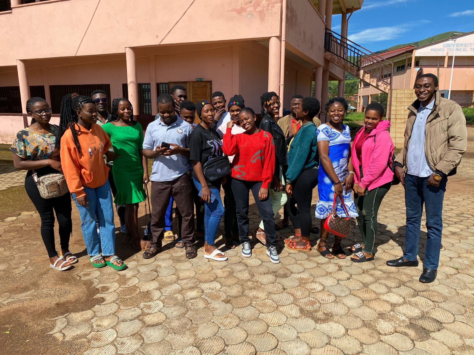 Students and trainers standing together outside at the first meeting of the programme